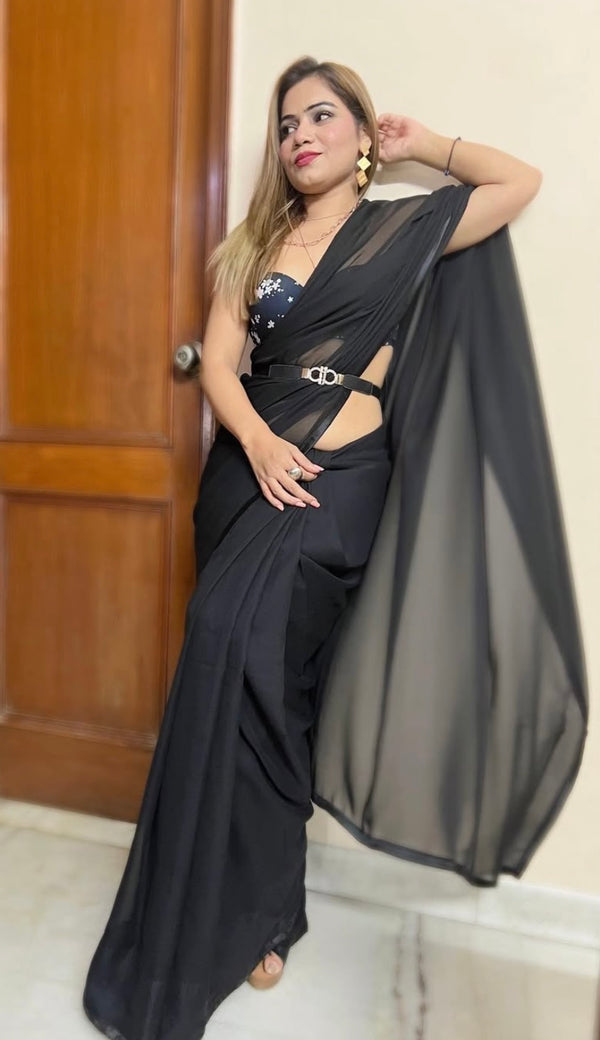 Black georgette saree with floral print blouse