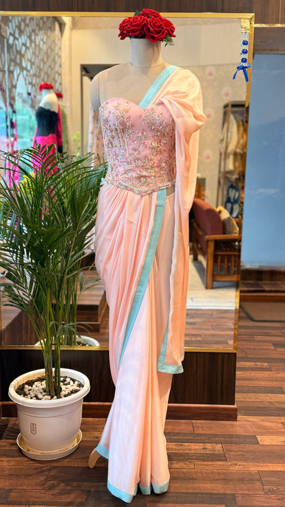 Baby Pink Embellished Corset with Blue Border Saree