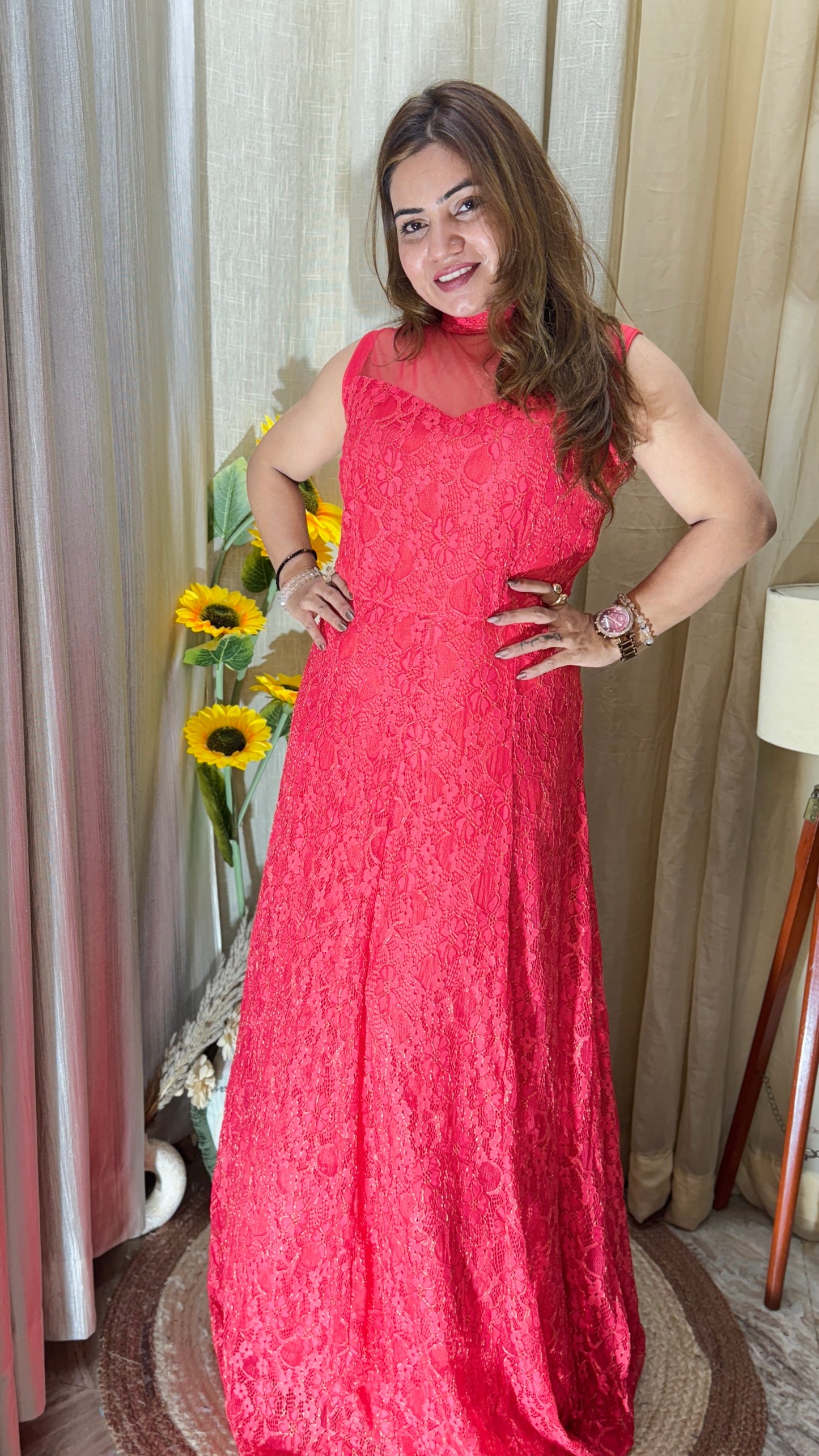 Sleeveless red lace gown