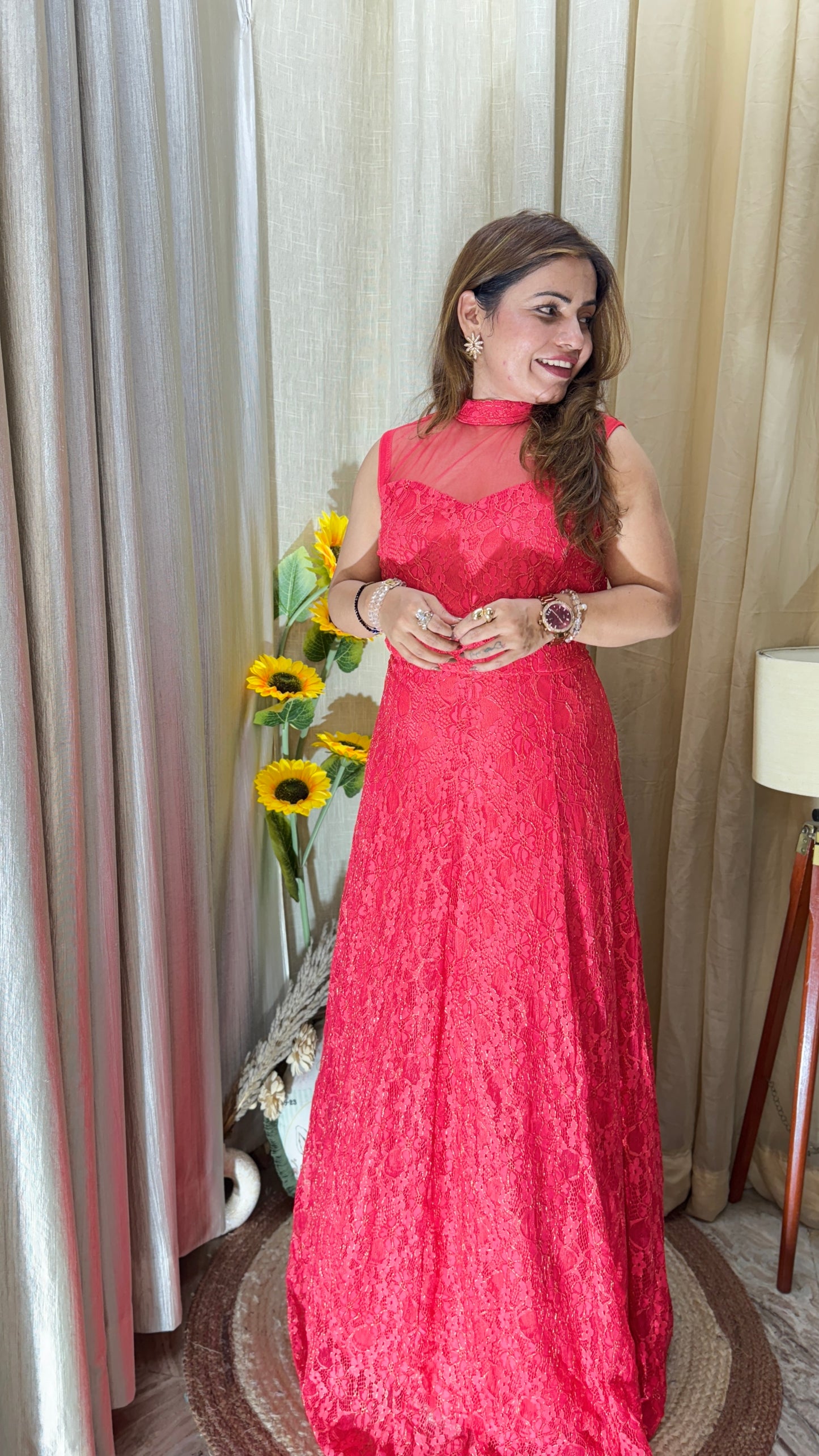 Sleeveless red lace gown