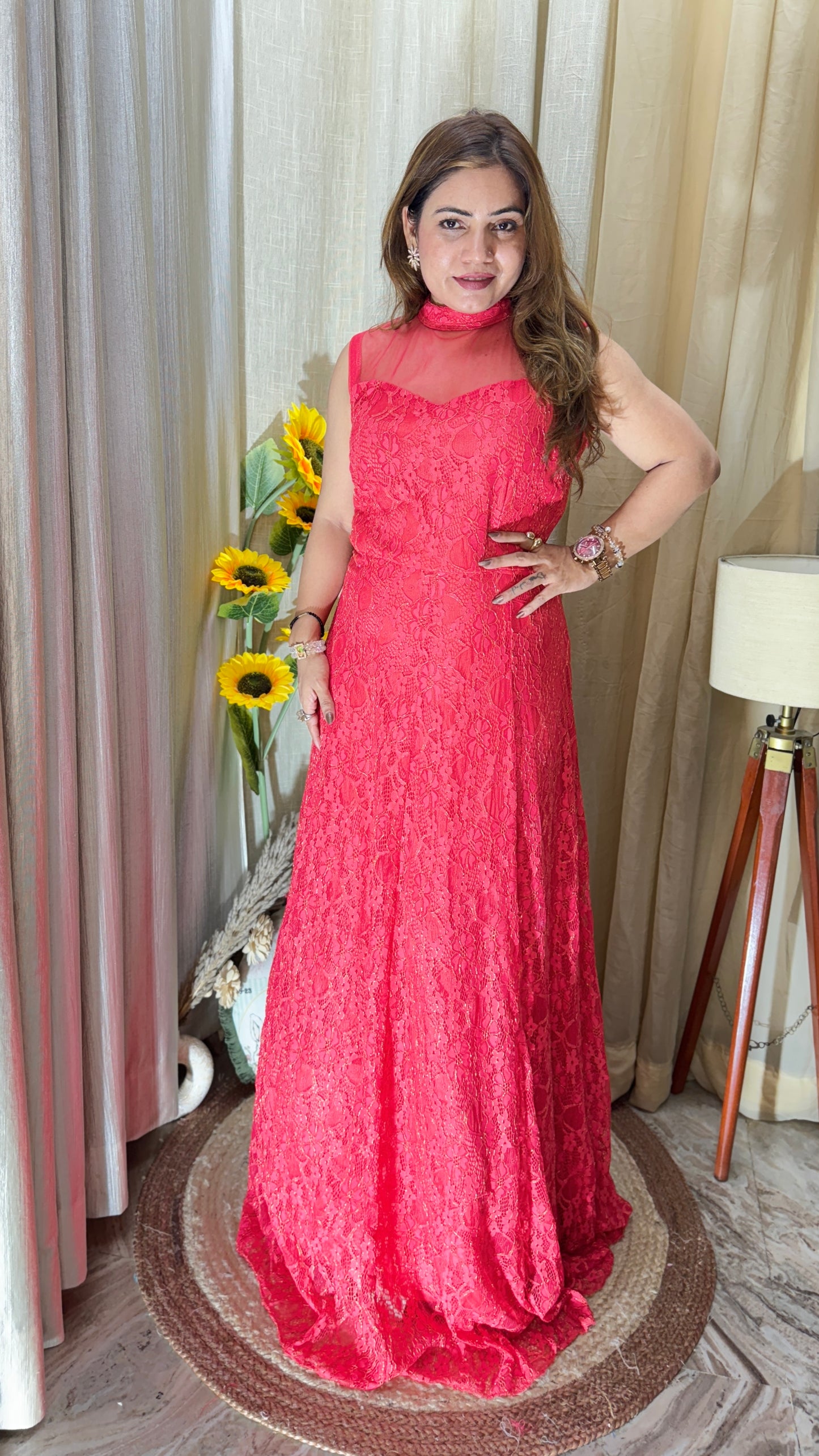 Sleeveless red lace gown